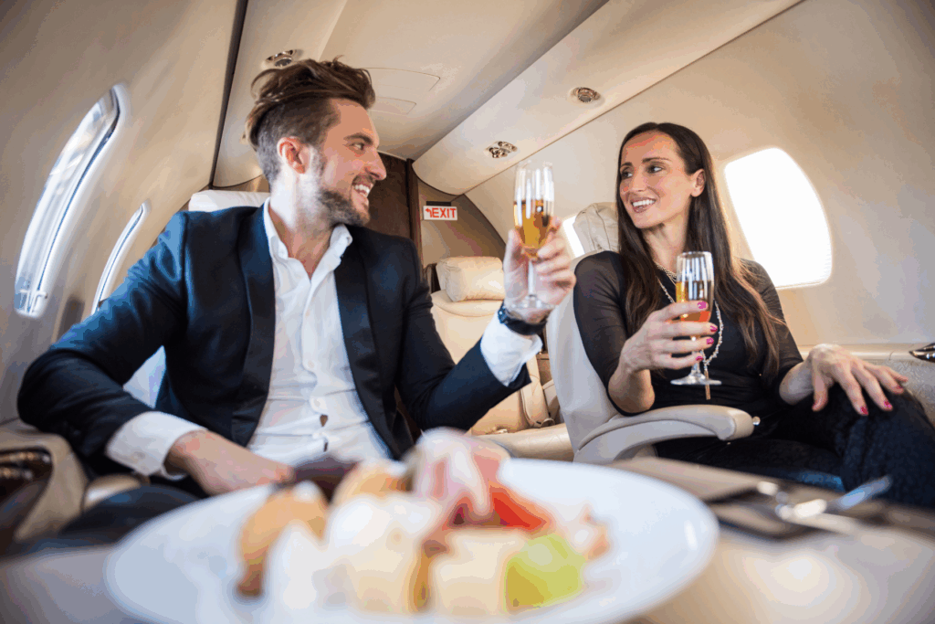 man and woman in first class travel using points and perks